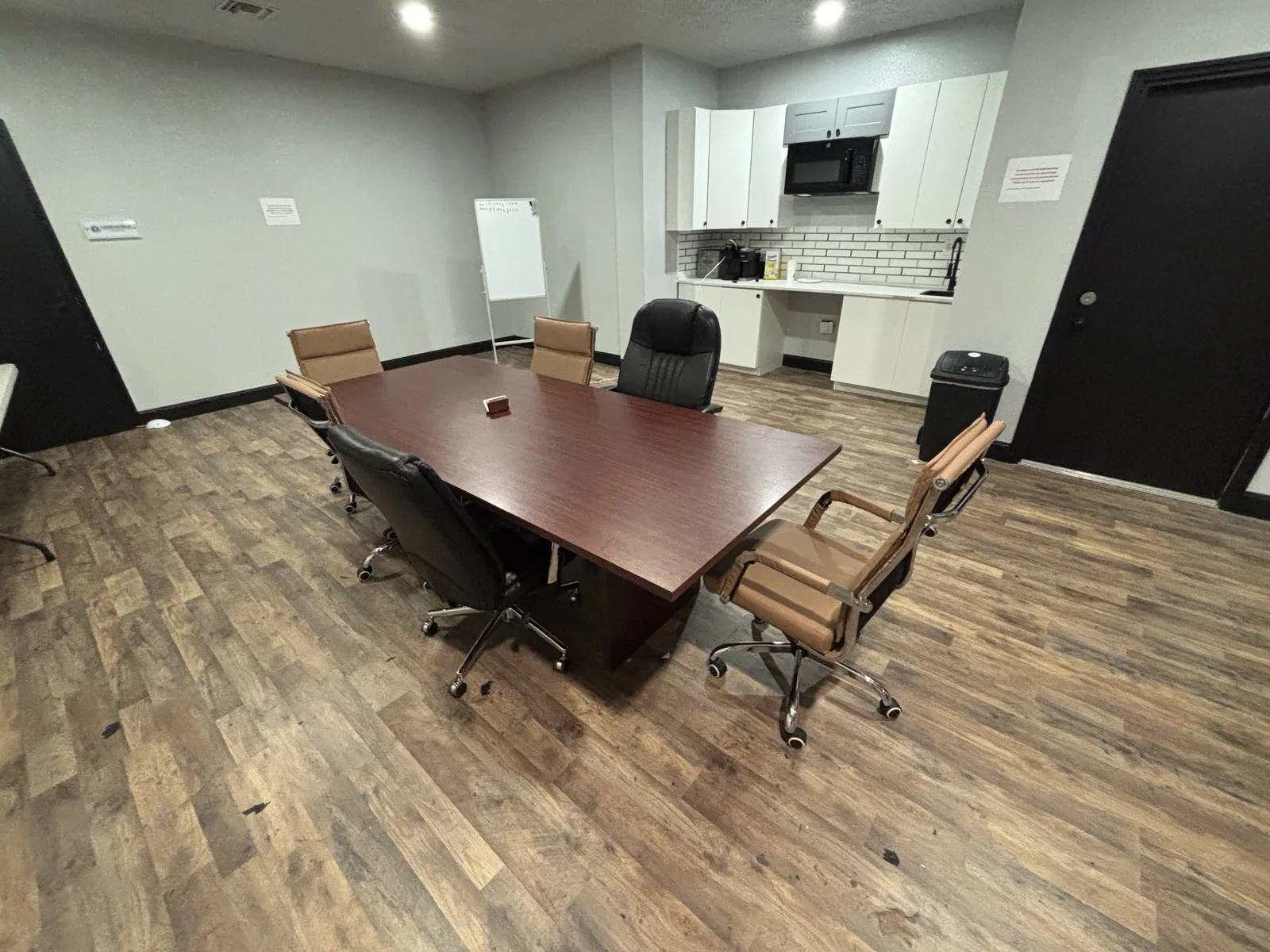 Conference room with seating and kitchen
