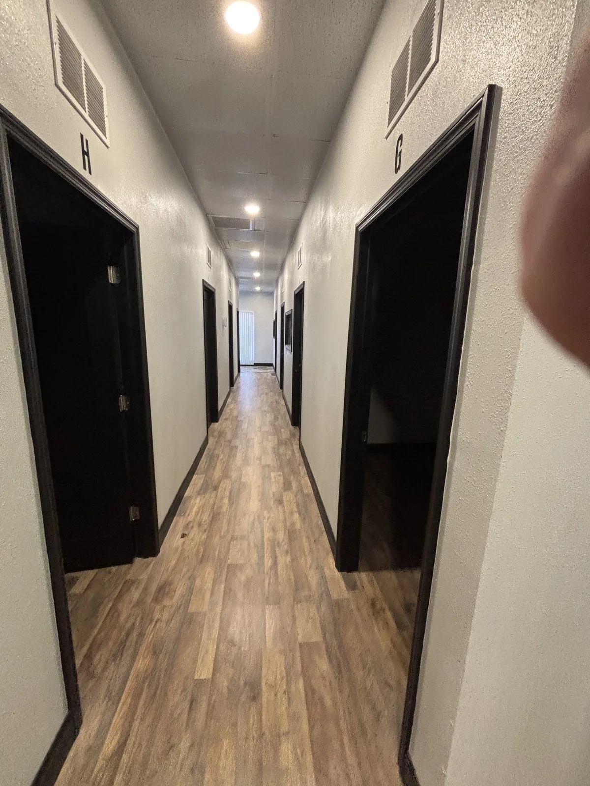 Hallway lined with private office suites